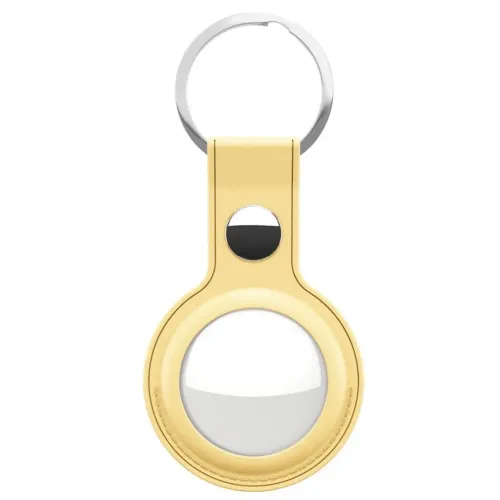 Lädernyckelring för AirTag i pastellgult läder med rund ram, metallknapp och silverfärgad nyckelring, frontvy och vit rund bricka i hållaren