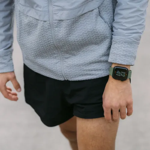 KeyBudz Journey Apple Watch strap in forest green, shown on a wrist with a black smartwatch face