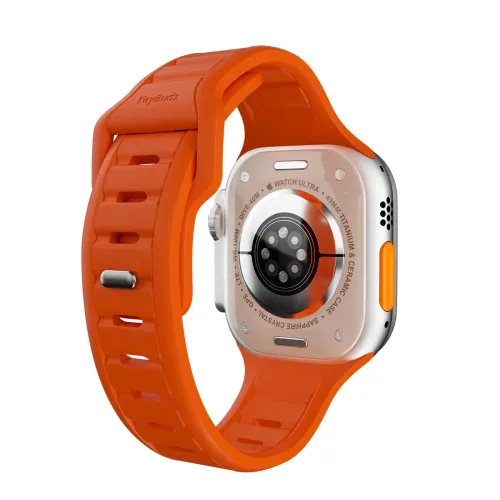 KeyBudz Journey Apple Watch-armbånd i elektrisk oransje, sporet design med sidestift som viser baksiden av klokken og festet.