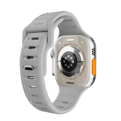 Kiviharmaa KeyBudz Apple Watch -ranneke, selkänäkymä, urainen hihna ja tappikiinnitys; oranssi sivupainike näkyvissä oikealla puolella.